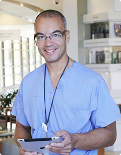 Dr. Aviles in scrubs
