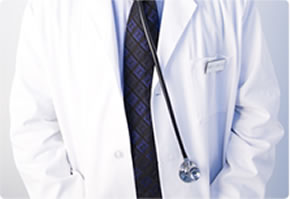 front of medical professional in lab coat with stethoscope hanging
